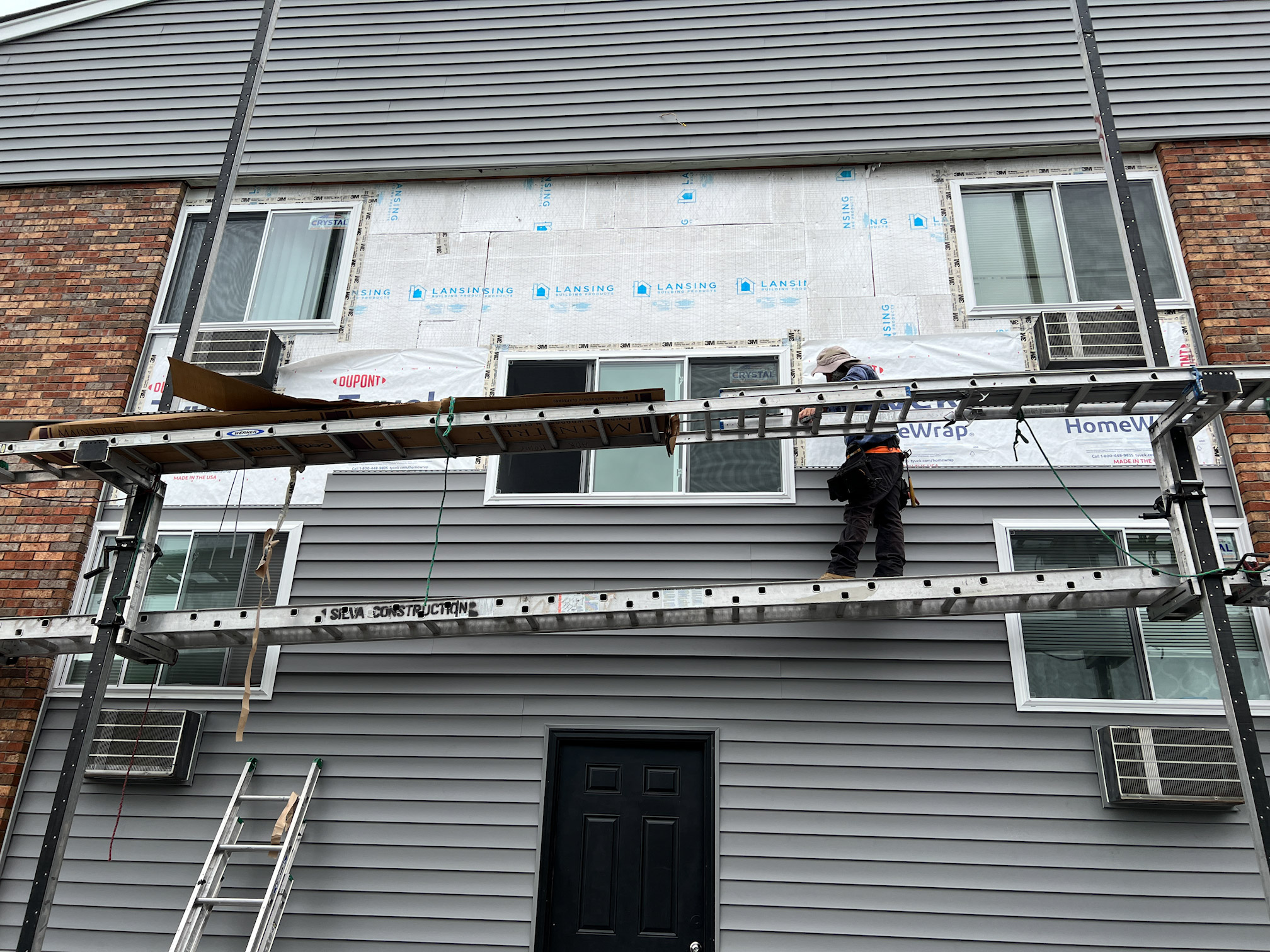Venture Window installing new Vinyl siding